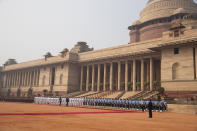 U.S. President Donald Trump reviews a guard of honor during a ceremonial reception at Rashtrapati Bhavan, the Indian Presidential Palace, in New Delhi, India, Tuesday, Feb. 25, 2020. (AP Photo/Alex Brandon)