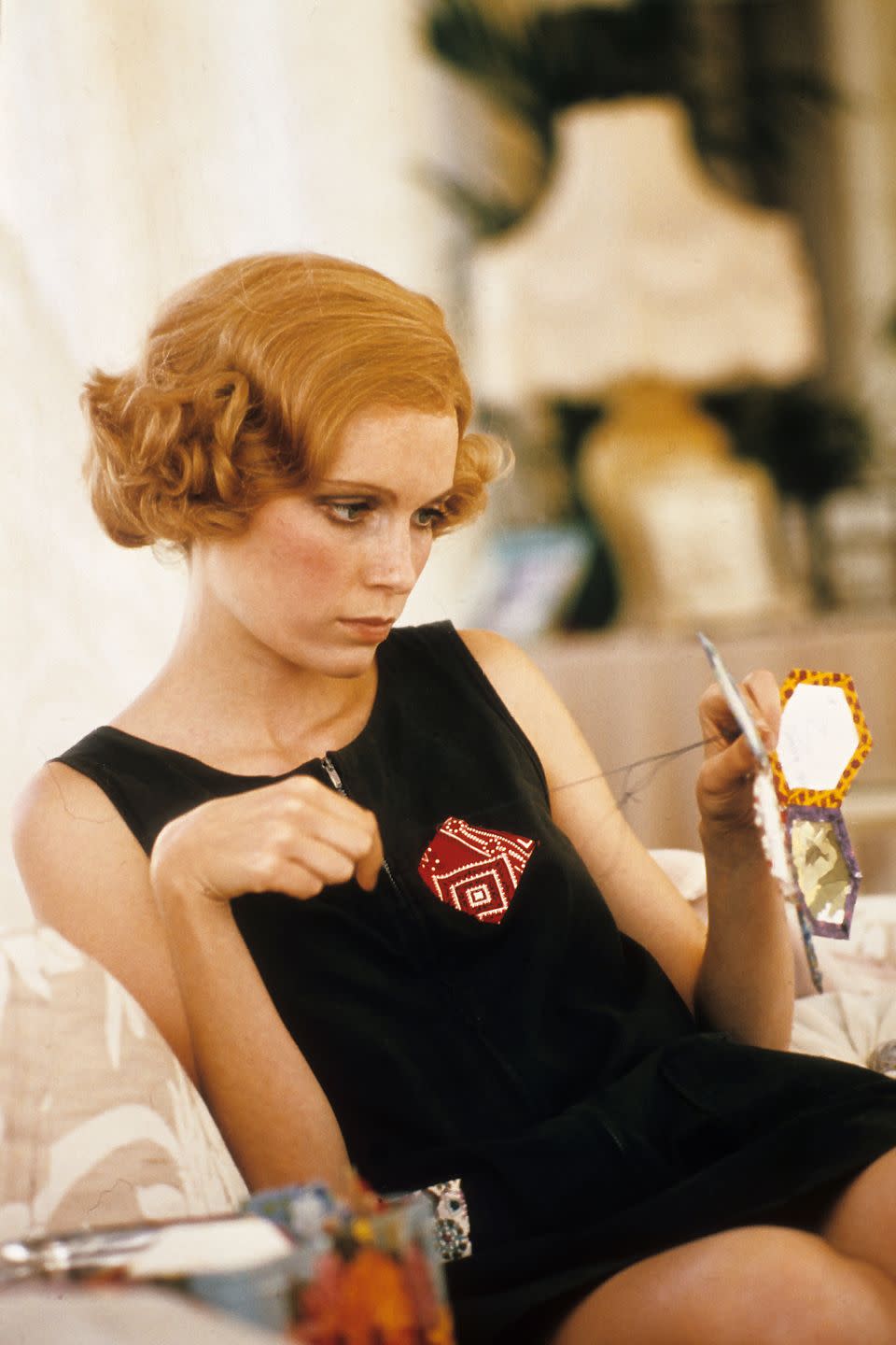 <p>In-between scenes of <em>The Great Gatsby</em>, Farrow needlepoints on-set. Although the actress was renowned for her role in the film, the part of Daisy was first offered to Natalie Wood, <a href="https://www.imdb.com/title/tt0071577/trivia#:~:text=Natalie%20Wood%20was%20offered%20the,idea%20and%20lost%20her%20chance.&text=Sam%20Waterston%20is%20a%20graduate,as%20his%20character%20Nick%20Carraway." rel="nofollow noopener" target="_blank" data-ylk="slk:who turned it down;elm:context_link;itc:0;sec:content-canvas" class="link ">who turned it down</a>.</p>
