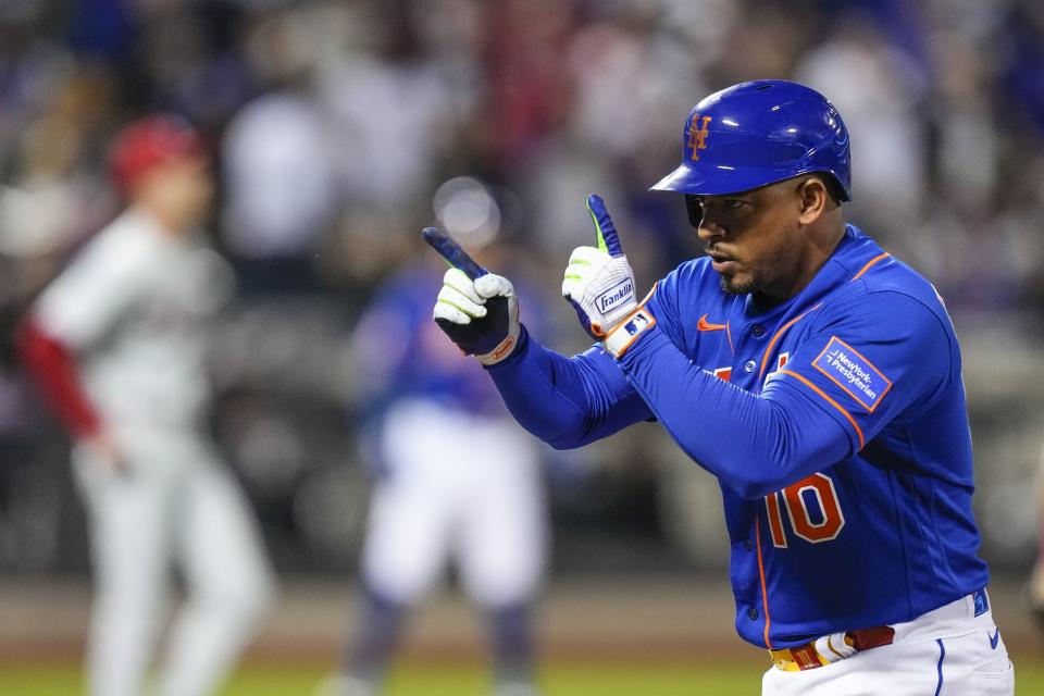 'New York Mets' Eduardo Escobar gestures to teammates after hitting an RBI single against the Philadelphia Phillies during the seventh inning of a baseball game Tuesday, May 30, 2023, in New York. (AP Photo/Frank Franklin II)