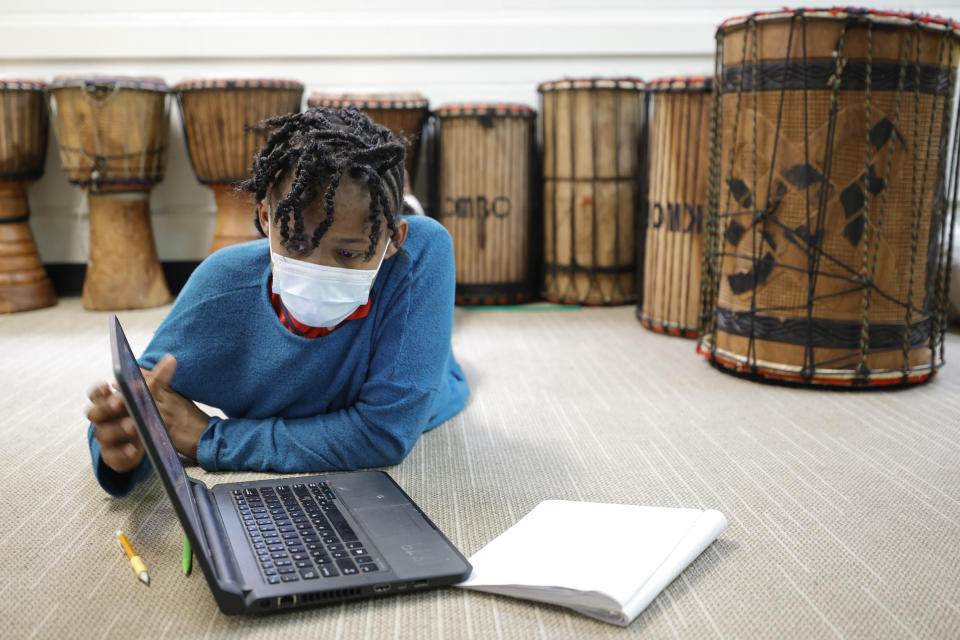 Celeste Banks, 10, of Decatur, Ga., works on a math test in class at the Kilombo Academic and Cultural Institute, Tuesday, March 28, 2023, in Decatur, Ga. (AP Photo/Alex Slitz)