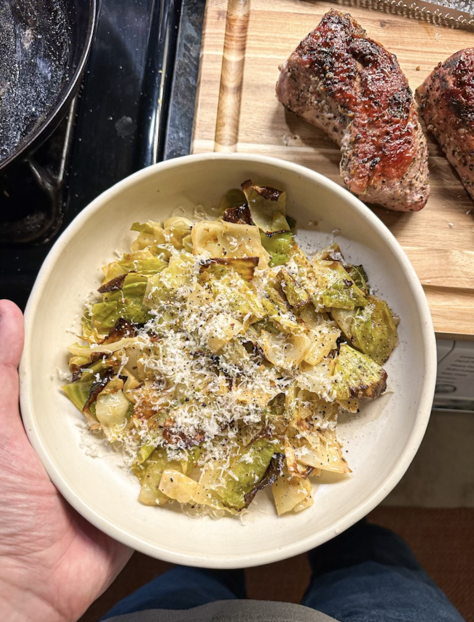 Cabbage salad in a bowl topped with cheese