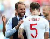 <p>Manager Gareth Southgate and defender John Stones celebrate after the final whistle. </p>