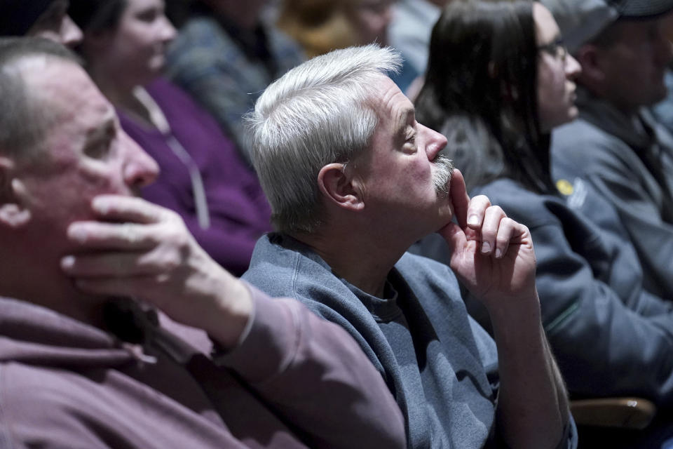 East Palestine residents listen to a town hall meeting at East Palestine High School concerning the Feb. 3 Norfolk Southern freight train derailment in East Palestine, Ohio, Friday, Feb. 24, 2023. (AP Photo/Matt Freed)