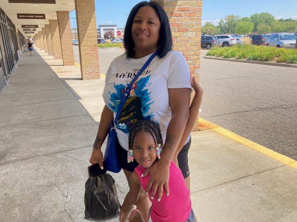 Tish Terry, a metro Detroit mother, shops with her daughter Zuri in Southfiled on Aug. 16. Terry has three children who will be going to school this year and estimates she could spend $2,000 getting them ready for school.