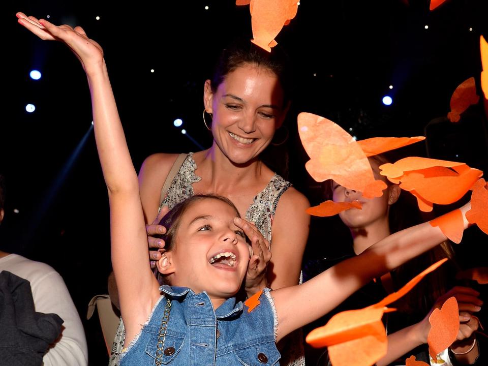 Suri Cruise (L) and actress Katie Holmes in the audience during Nickelodeon's 28th Annual Kids' Choice Awards held at The Forum on March 28, 2015 in Inglewood, California