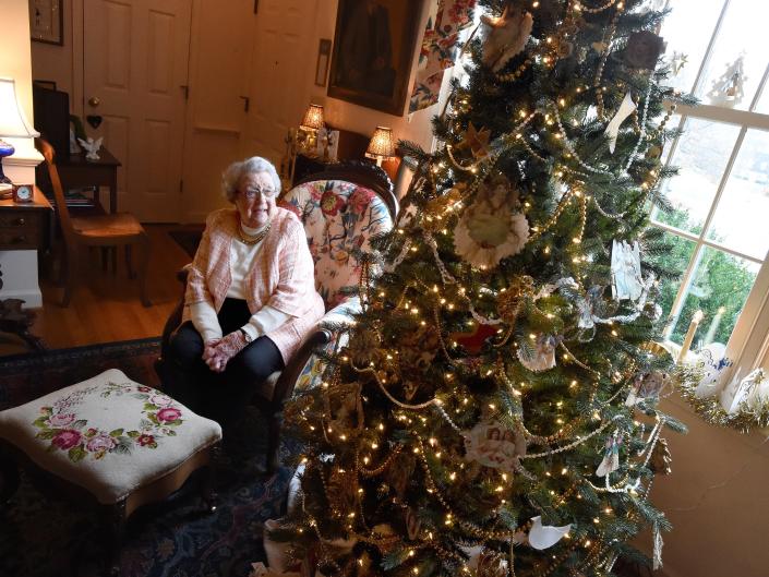 Doris Dixon, 96, talks about the century old ornaments on her Christmas tree during an interview at her home in Staunton on Tuesday, Dec. 23, 2014. The ornaments were handcrafted by her great-grandmother, Laura Rodkey, back in 1897. 