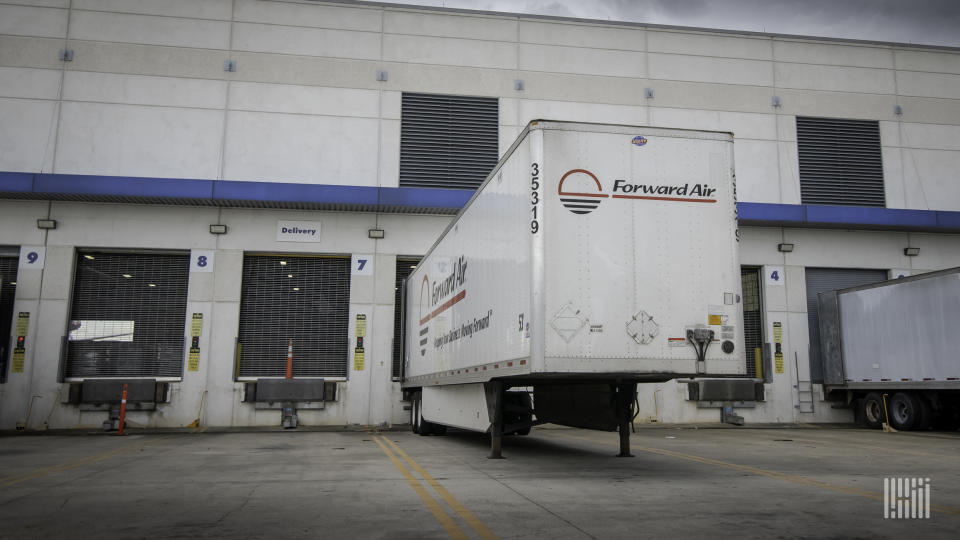 A white Forward Air trailer at a warehouse