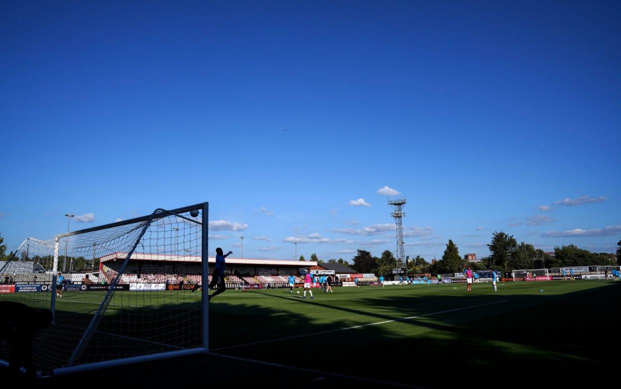 General view as the players warm up on the pitch ahead of the Vanarama National League elimination match at Meadow Park, Borehamwood - PA