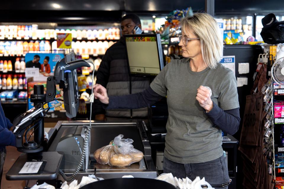 Ashley Hale checks a customer out Jan. 31 at The Market at EastPoint in Oklahoma City.