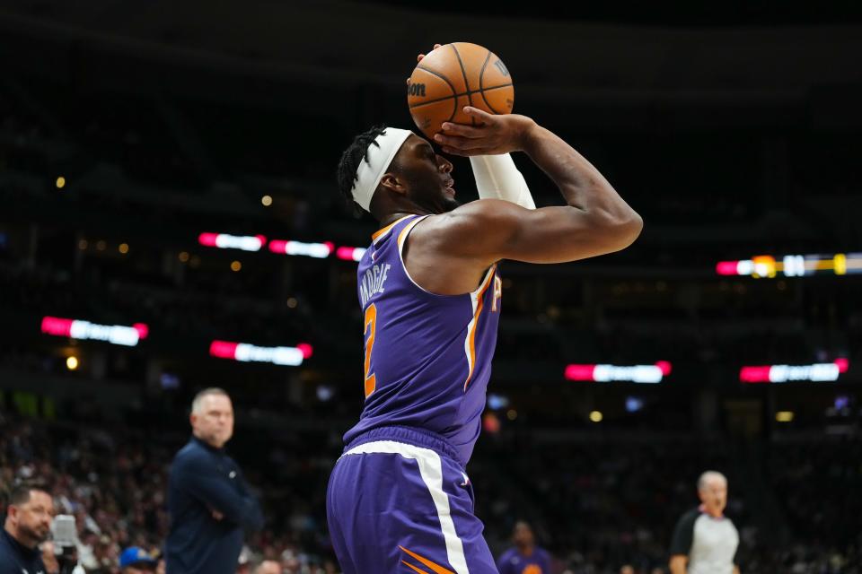 Oct 10, 2022; Denver, Colorado, USA; Phoenix Suns forward Josh Okogie (2) lines up a shot in the second quarter against the Denver Nuggets at Ball Arena.