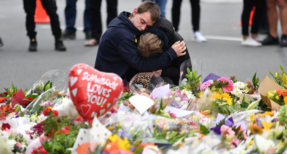 Members of the public mourn at a flower memorial near the Al Noor Masjid on Deans Rd in Christchurch on Saturday, March 16, 2019. Source: AAP