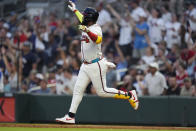 Atlanta Braves designated hitter Marcell Ozuna gestures as he runs the bases after hitting a home run in the third inning of a baseball game against the Boston Red Sox Wednesday, May 8, 2024, in Atlanta. (AP Photo/John Bazemore)