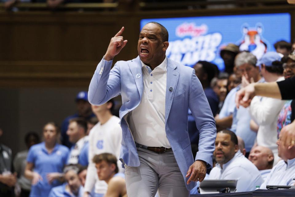 North Carolina coach Hubert Davis shouts to players during the second half of the team's NCAA college basketball game against Duke in Durham, N.C., Saturday, March 9, 2024. (AP Photo/Ben McKeown)