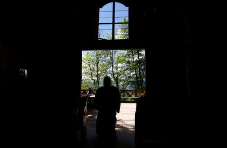 Hermit Stan Vanuytrecht of Belgium walks into the chapel of the hermitage in Saalfelden, Austria, May 22, 2017. Picture taken May 22, 2017. REUTERS/Leonhard Foeger