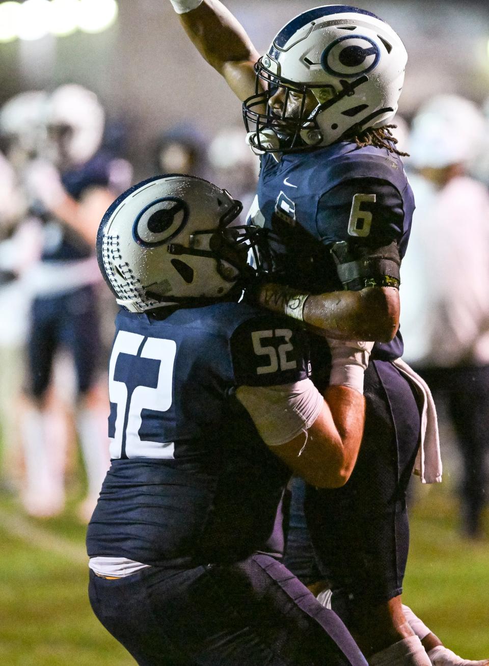 Central Valley Christian's Tyler Hughes, left, and Bryson Donelson celebrate against Tulare Union in a CIF Central Section Division II football championship semifinal Friday, November 17, 2023.