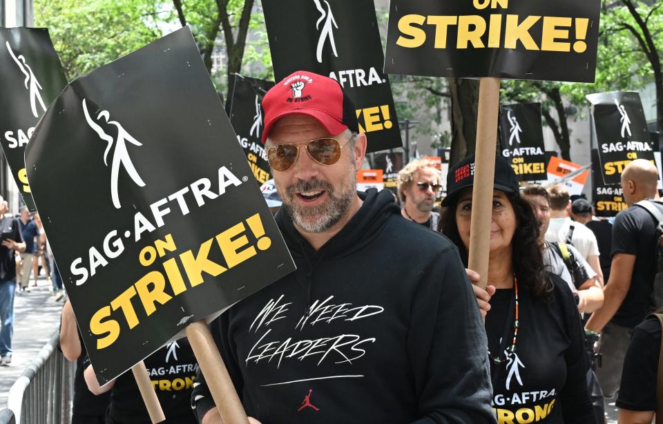 Jason Sudeikis joins members of the Writers Guild of America and the Screen Actors Guild as they walk a picket line outside NBC Universal in New York City on July 14, 2023.