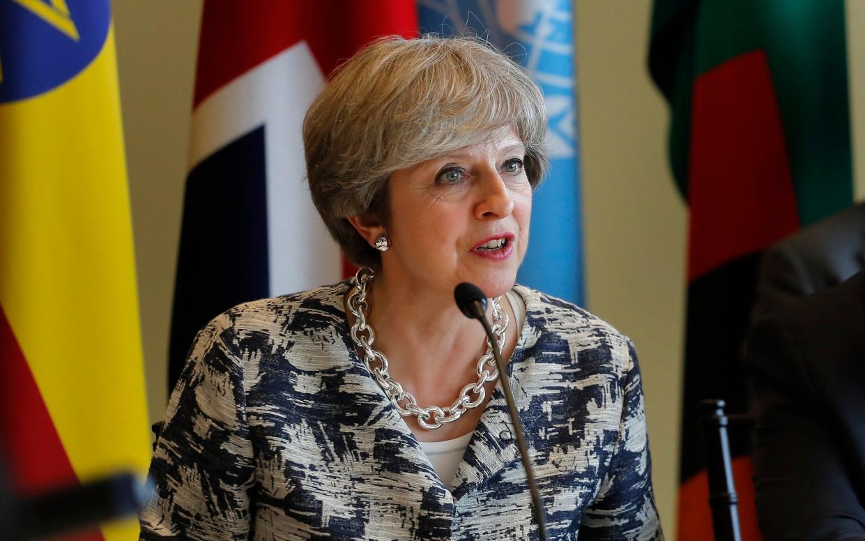 Theresa May is to make the demands of technology companies at a UN meeting  - AP