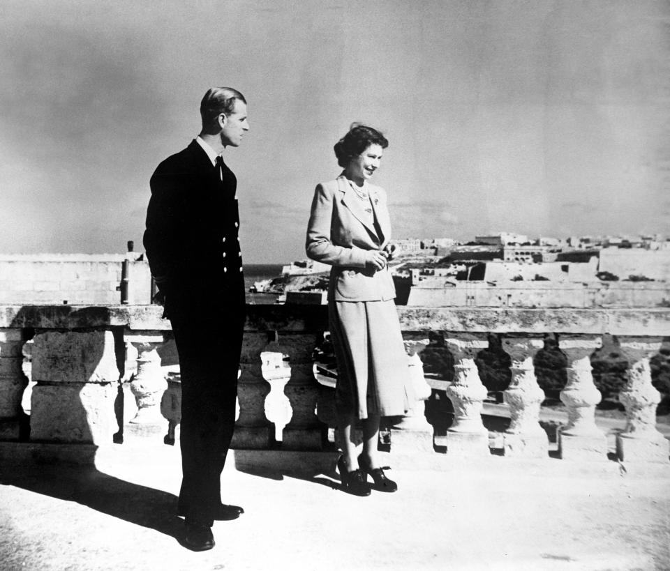 <p>Princess Elizabeth and the Duke of Edinburgh look over Valetta from the roof of the Villa Guardamangia, Malta, where they lived in 1949-51. Philip was serving as a First Lieutenant aboard HMS Chequers. (PA Images via Getty Images)</p> 