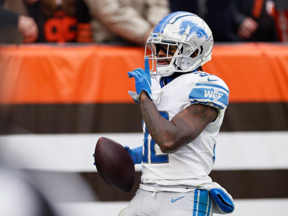 D'Andre Swift celebrates a touchdown against the Cleveland Browns.