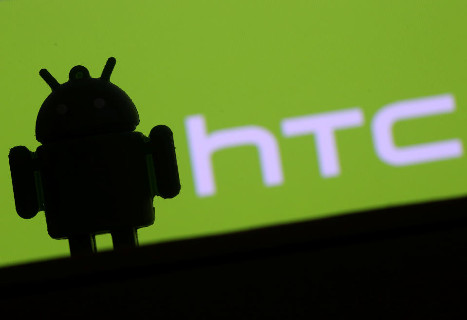 A 3D printed Android mascot Bugdroid is seen in front of an HTC logo in this illustration taken September 21, 2017. REUTERS/Dado Ruvic/Illustration