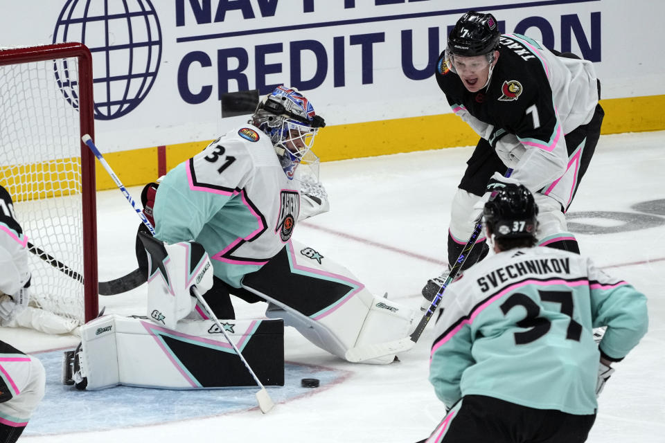 Metropolitan Division's goaltender Igor Shesterkin, of the New York Rangers (31) blocks a shot from Atlantic Division's Brady Tkachuk, of the Ottawa Senators (7) during the NHL All Star hockey game, Saturday, Feb. 4, 2023, in Sunrise, Fla. (AP Photo/Marta Lavandier)