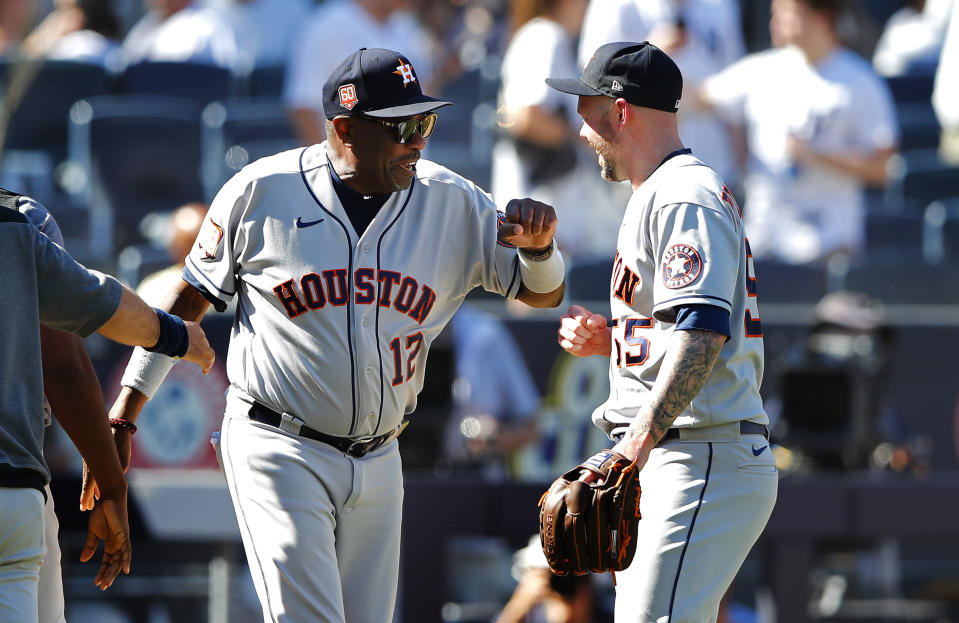 Houston Astros manager Dusty Baker Jr. (12) congratulates pitcher Ryan Pressly (55) after a combined no-hitter against the New York Yankees after a baseball game, Saturday, June 25, 2022, in New York. (AP Photo/Noah K. Murray)