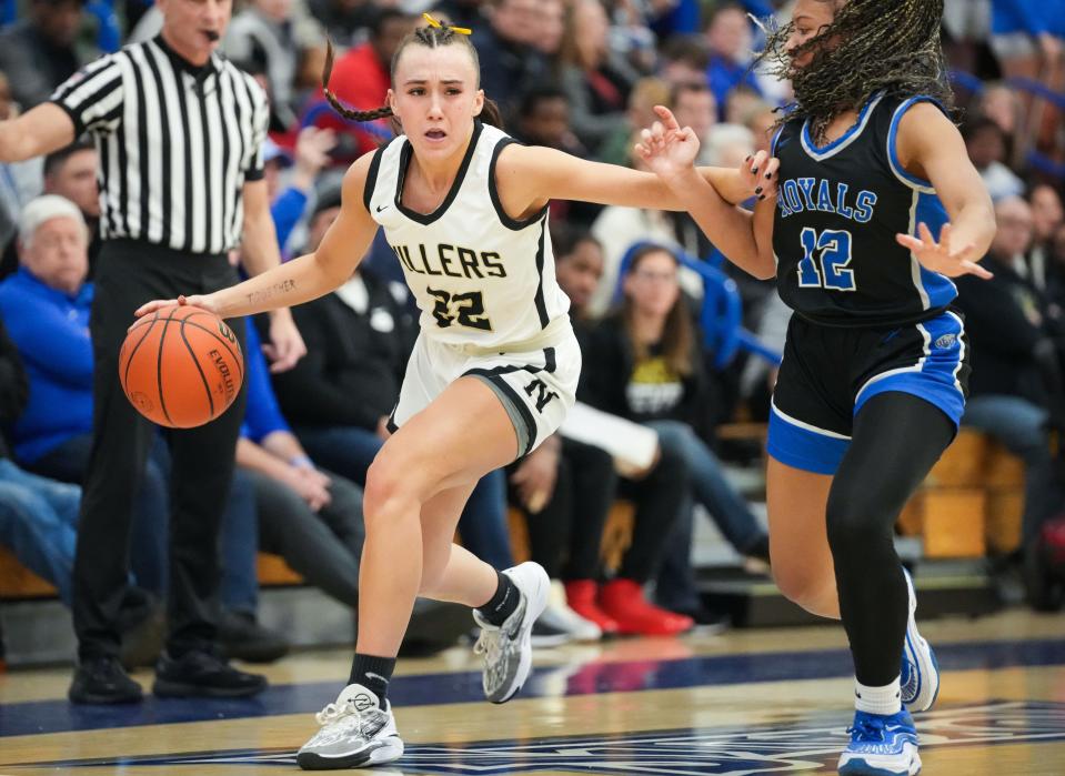 Noblesville Millers guard Reagan Wilson (22) rushes up the court against Hamilton Southeastern Royals guard Antonette Green (12) on Saturday, Feb. 3, 2024, during the IHSAA girls basketball sectional Class 4A game at Hamilton Southeastern High School in Indianapolis. The Noblesville Millers defeated the Hamilton Southeastern Royals, 49-45.