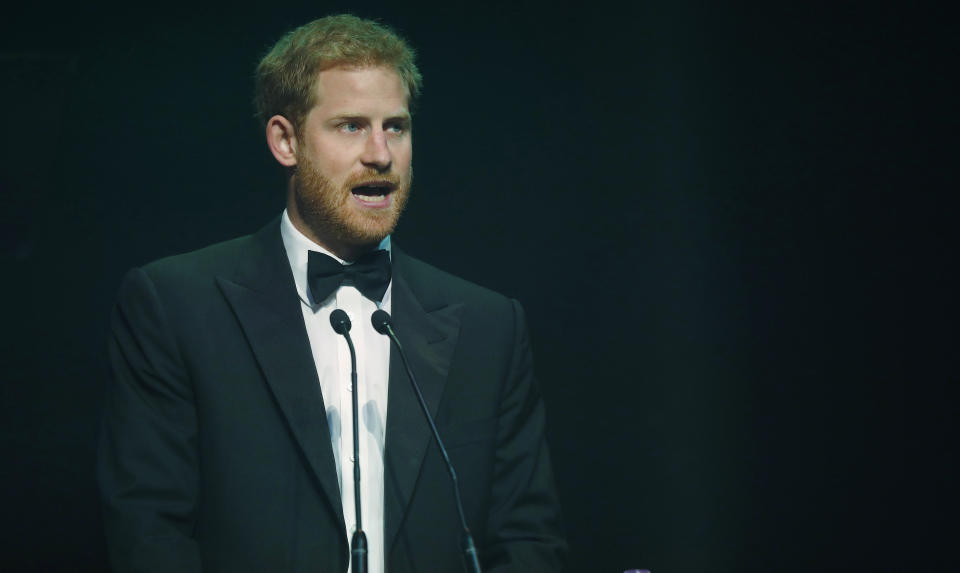 Prince Harry talks after receiving a posthumous Legacy Award on behalf of his mother at the Attitude Awards on October 12, 2017, in London. [Photo: Getty]