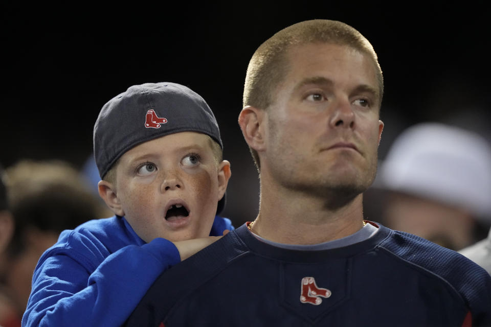 Boston Red Sox fans watch during the eighth inning in Game 5 of baseball's American League Championship Series against the Houston Astros Wednesday, Oct. 20, 2021, in Boston. (AP Photo/David J. Phillip)