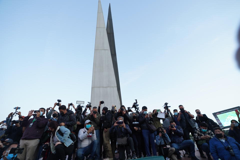 People and journalists join a national protest against the murder of journalist Lourdes Maldonado and freelance photojournalist Margarito Martínez, at the Mexico monument in Tijuana, Mexico, Tuesday, Jan. 25, 2022. Mexico's Interior Undersecretary Alejandro Encinas said recently that more than 90% of murders of journalists and rights defenders remain unresolved, despite a government system meant to protect them. (AP Photo/Marco Ugarte)