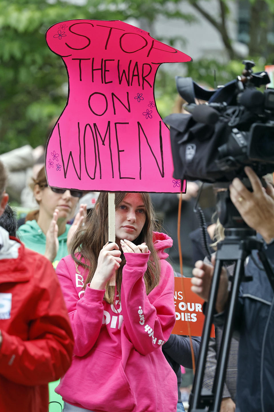 Cora Field, of Chapel Hill, NC, listens to speakers at a rally at Bicentennial Plaza put on by Planned Parenthood South Atlantic in response to a bill before the North Carolina Legislature, Wednesday, May 3, 2023, in Raleigh, N.C. (AP Photo/Karl B DeBlaker)