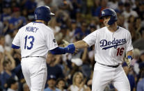 Los Angeles Dodgers' Will Smith (16) celebrates his two-run home run with Max Muncy (13) during the third inning of the team's baseball game against the Toronto Blue Jays on Tuesday, Aug. 20, 2019, in Los Angeles. (AP Photo/Marcio Jose Sanchez)