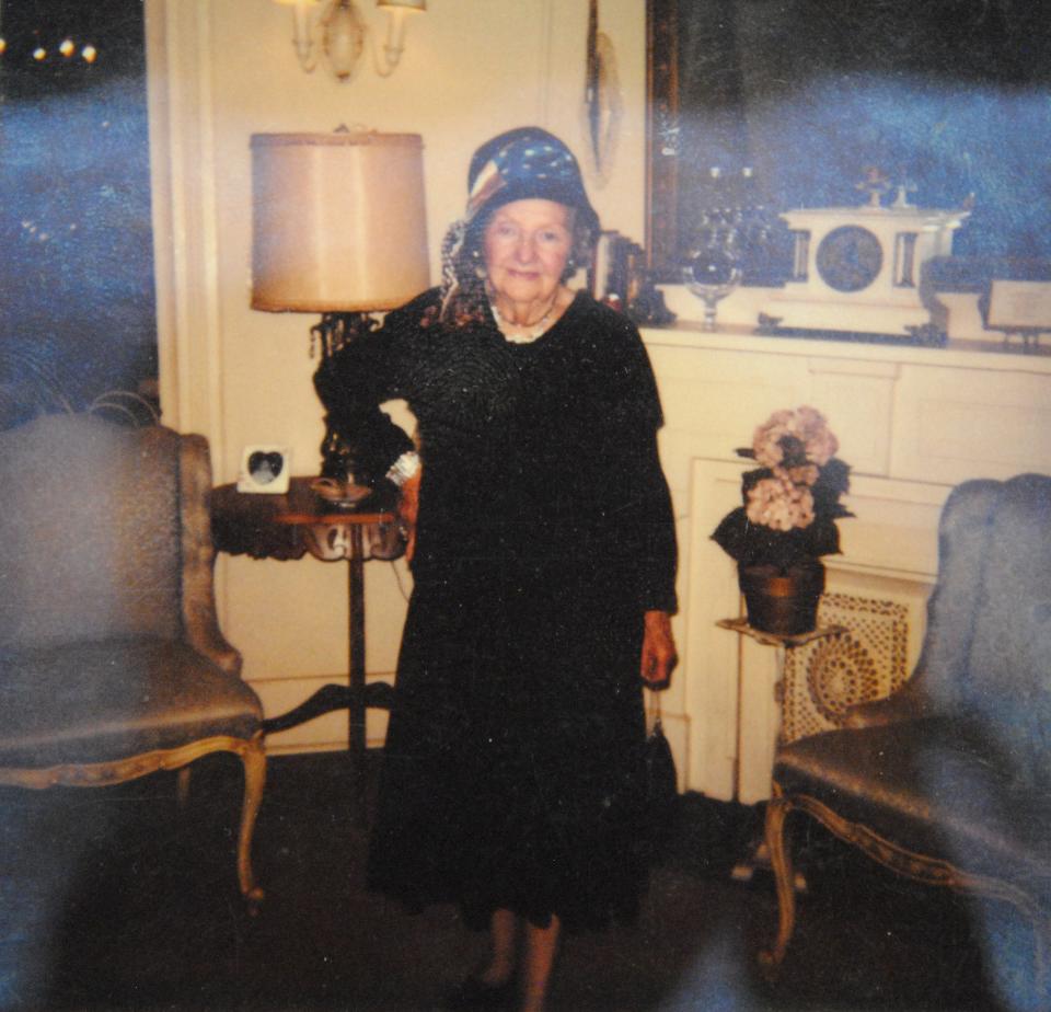 Pansy Brown is seen in the home at 1400 Travis by the fireplace in this undated photo.Pansy lived in the home for many years.