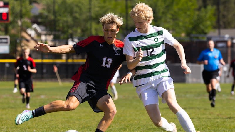 Left to right, Alta’s Bode Bjerregaard and Olympus’ Ezra Heyes battle for possession of the ball during the second round of 5A boys soccer playoffs at Alta High School in Sandy on Tuesday, May 14, 2024.