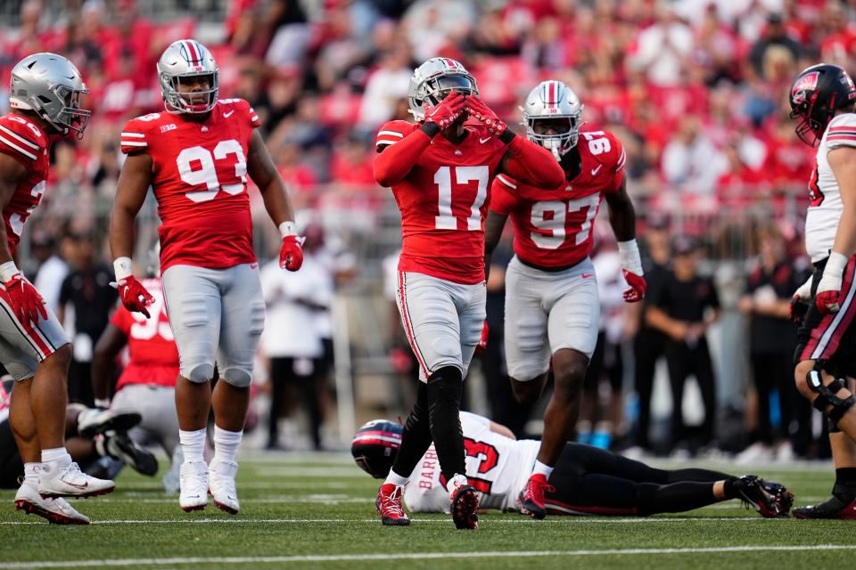 Ohio State linebacker Mitchell Melton celebrates a sack of Western Kentucky quarterback Bronson Barron.