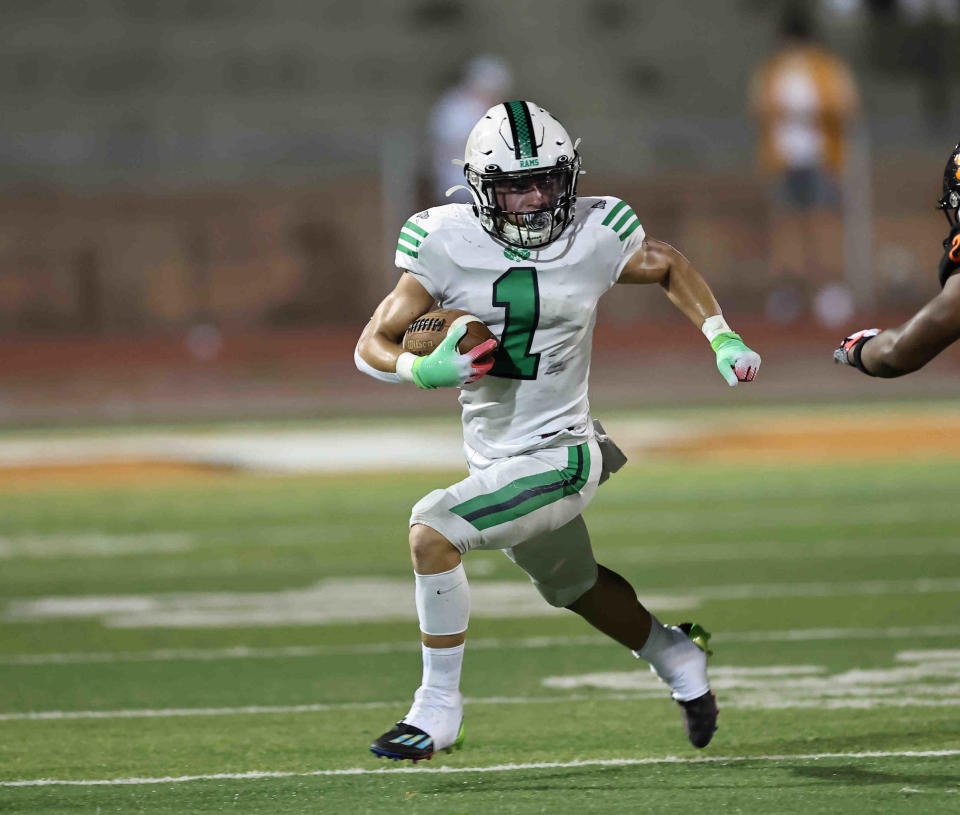 Hamilton Badin running back Carter Russo runs the ball during a football game between Withrow and Badin high schools Friday, Sept. 2, 2022.