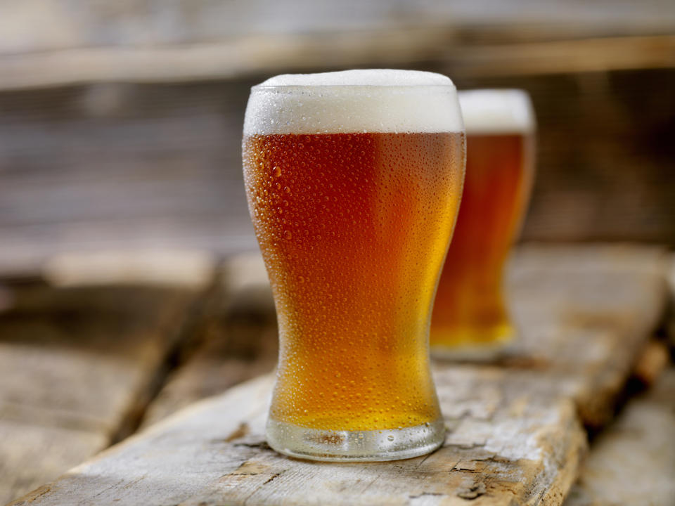 glass of beer on a table to use as a natural hair rinse