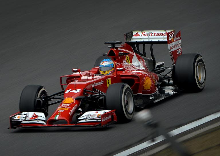 Scuderia Ferrari driver Fernando Alonso of Spain drives down the straight before posting the fastest time during the first practice session of the Formula One Chinese Grand Prix in Shanghai on April 18, 2014