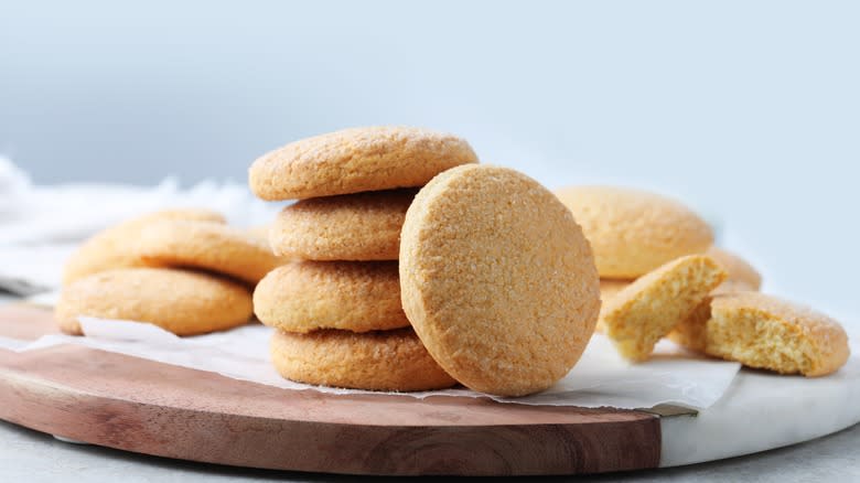 Pile of sugar cookies on wood board