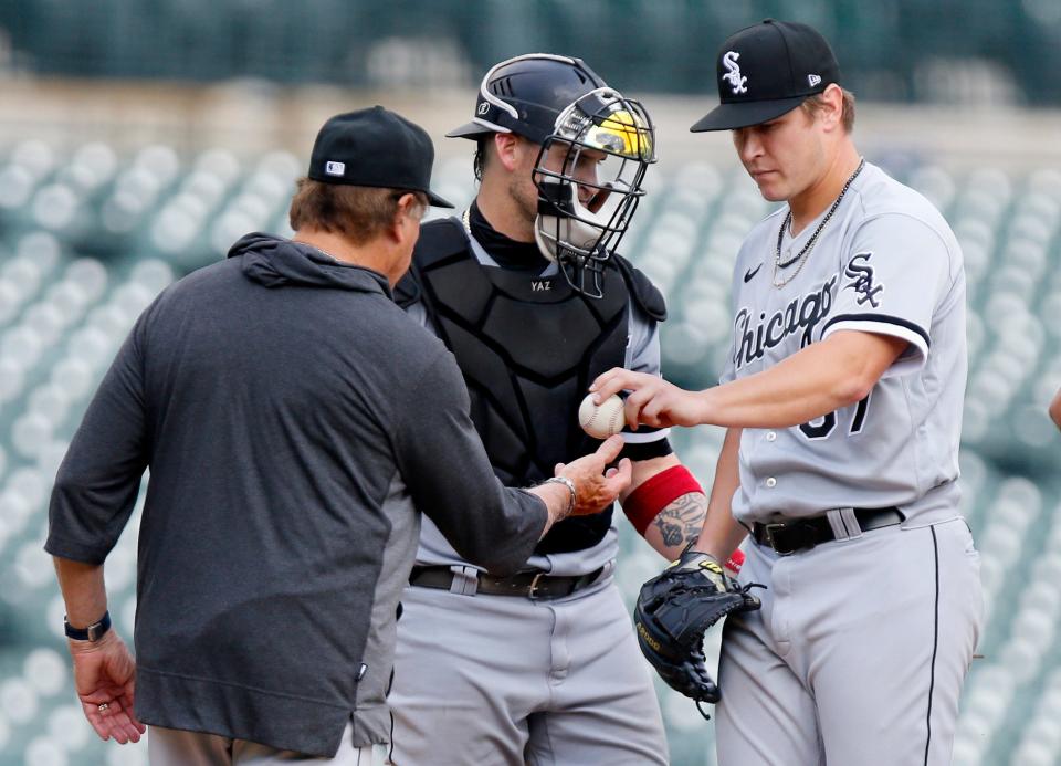 Chicago White Sox relief pitcher Jace Fry is pulled by manager Tony La Russa, with catcher Yasmani Grandal looking on, during the seventh inning of a baseball game against the Detroit Tigers, Tuesday, Sept. 21, 2021, in Detroit. The Tigers defeated the White Sox 5-3. (AP Photo/Duane Burleson)