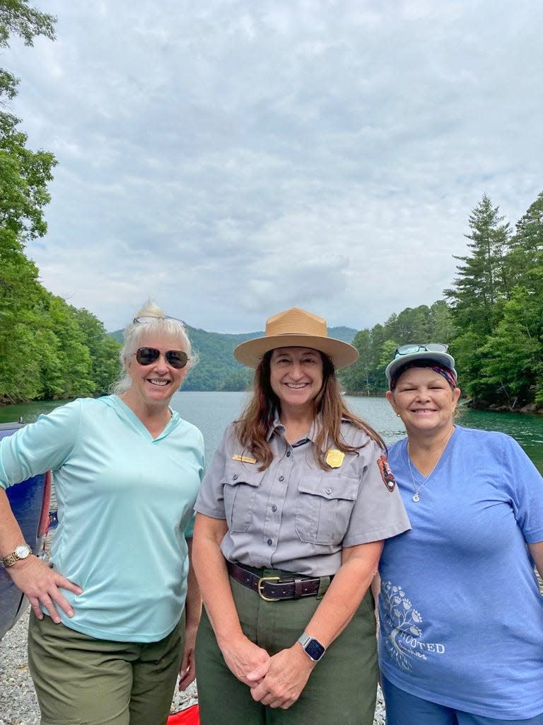 Dana Soehn, center, management assistant with Great Smoky Mountains National Park, shown here with Janice Johnson and Patti Higgins, was among a crowd of nearly 100 people who gathered for Bone Valley Decoration Day on June 26.