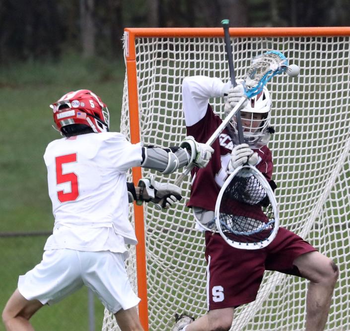 Kevin Morina of North Rockland scores on Scarsdale goalie Andrew Lehrman during a varsity lacrosse game at North Rockland High School May 2, 2022. Scarsdale defeated North Rockland 15-5.