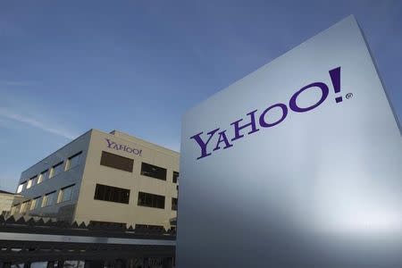 A Yahoo logo is pictured in front of a building in Rolle, 30 km (19 miles) east of Geneva, in this file picture taken December 12, 2012. REUTERS/Denis Balibouse