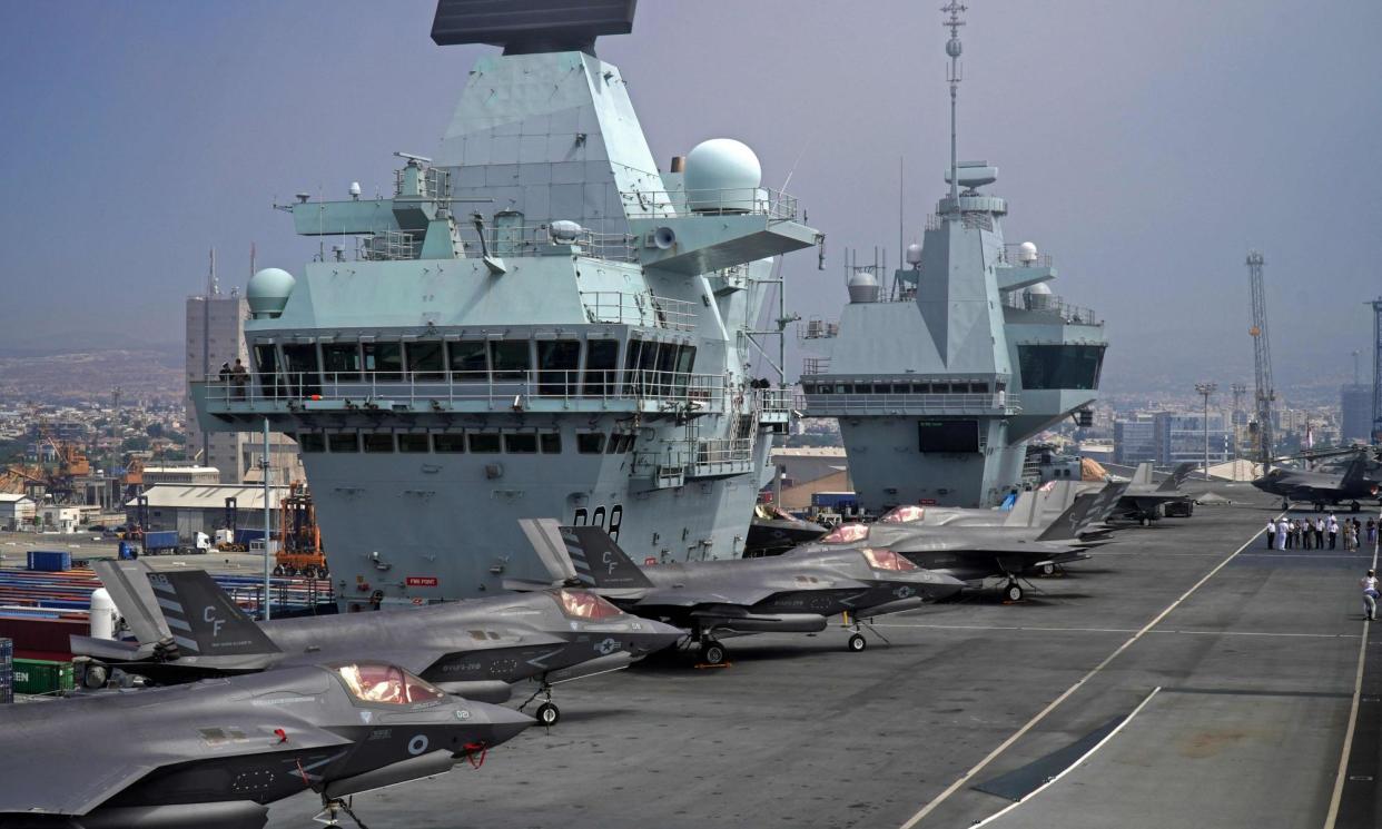 <span>Combat aircraft on the deck of the Royal Navy's HMS Queen Elizabeth.</span><span>Photograph: Roy Issa/AFP/Getty</span>