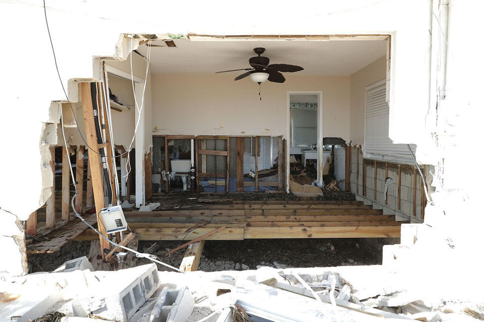 <p>A waterfront home is left with a giant hole after being destroyed by Hurricane Irma on Sept. 12, 2017 in Marathon, Florida. The Federal Emergency Managment Agency has reported that 25-percent of all homes in the Florida Keys were destroyed and 65-percent sustained major damage when they took a direct hit from Hurricane Irma. (Photo: Chip Somodevilla/Getty Images) </p>