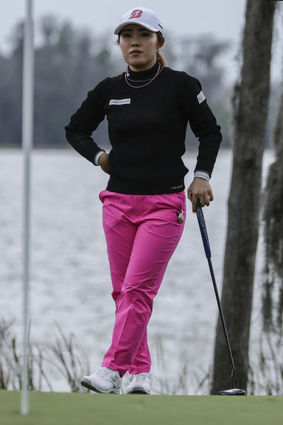 Ayaka Furue waits to putt on the 18th green during the first round of the Hilton Grand Vacations Tournament of Champions LPGA golf tournament in Orlando, Fla., Thursday, Jan. 18, 2024. (AP Photo/Kevin Kolczynski)
