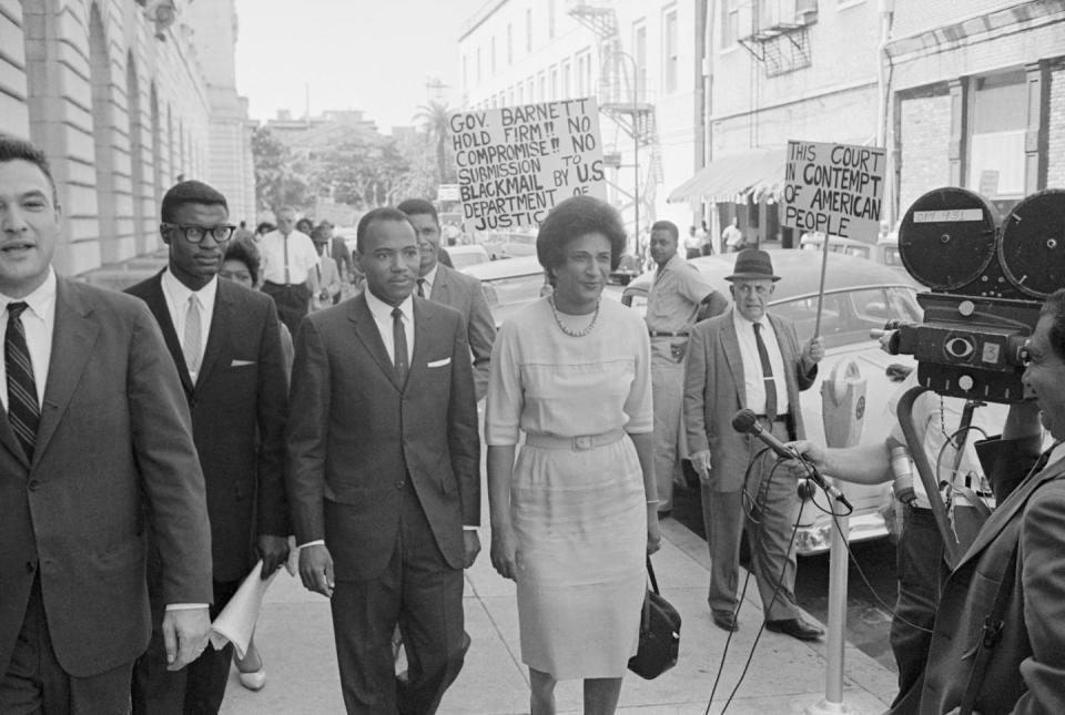 James Meredith, center, and attorney Constance Motley, right, on Sept. 28, 1962, outside the 5th U.S. Circuit Court of Appeals in New Orleans, which that day ordered Mississippi Gov. Ross Barnett to facilitate Meredith’s admission to the University of Mississippi or face arrest and fine. <a href="https://www.gettyimages.com/detail/news-photo/james-meredith-and-his-attorney-constance-motley-were-news-photo/515030524?adppopup=true" rel="nofollow noopener" target="_blank" data-ylk="slk:Bettman/Getty Images;elm:context_link;itc:0;sec:content-canvas" class="link ">Bettman/Getty Images</a>