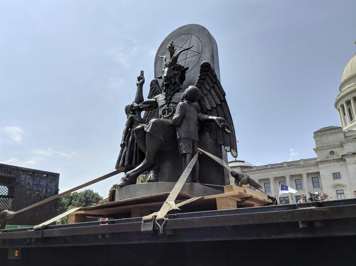 <span class="caption">The Satanic Temple unveils a statue of Baphomet, a winged-goat creature, at a rally for the First Amendment in Little Rock, Arkansas, in August 2018.</span> <span class="attribution"><a class="link " href="http://www.apimages.com/metadata/Index/Satanic-Temple/fc28a9277fc6499dab6fb9281368d0e2/1/0" rel="nofollow noopener" target="_blank" data-ylk="slk:AP Photo/Hannah Grabenstein;elm:context_link;itc:0;sec:content-canvas">AP Photo/Hannah Grabenstein</a></span>