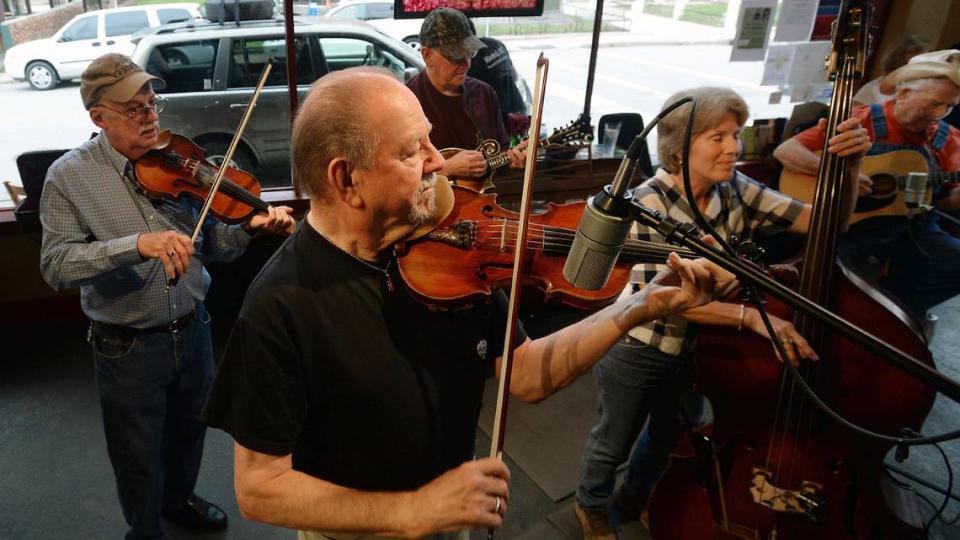 Bobby Hicks, a fiddler from the bluegrass pantheon plays with other musicians in Marshall, N.C. in 2014.