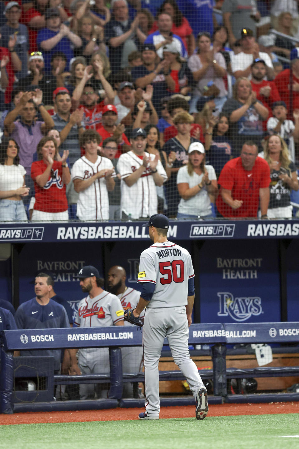 Atlanta Braves starting pitcher Charlie Morton receives an ovation from a contingent of Braves fans after his removal during the seventh inning of the team's baseball game against the Tampa Bay Rays on Friday, July 7, 2023, in St. Petersburg, Fla. (AP Photo/Mike Carlson)